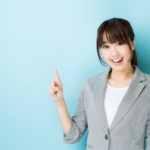portrait of asian businesswoman on blue background