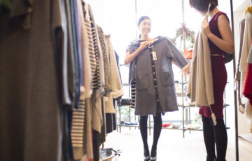 Women are choosing clothes with friends