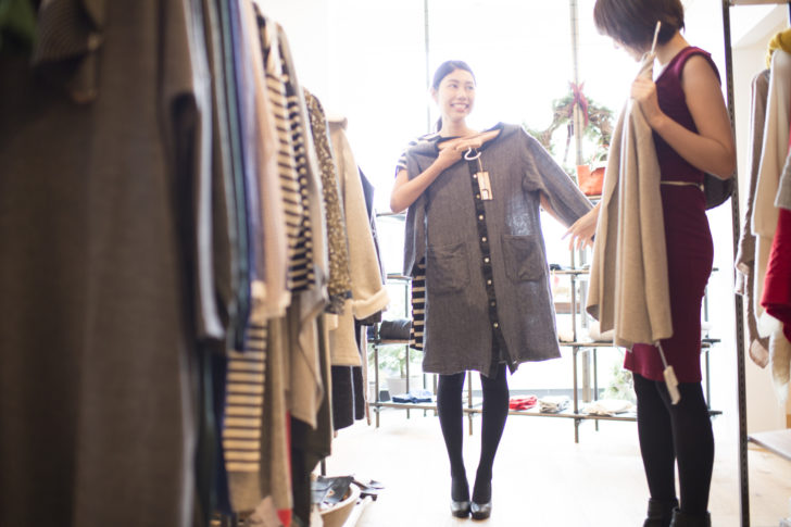 Women are choosing clothes with friends