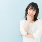 attractive asian woman on blue background