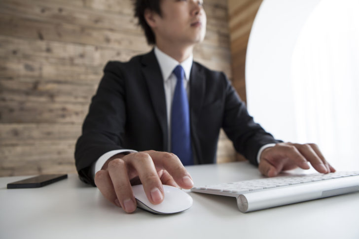 Businessmen are using the computer